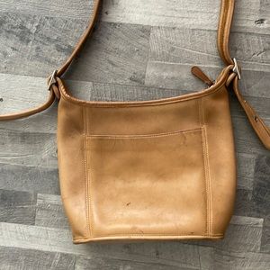 Tan leather coach. Light spots will come out with cleaner or awesome